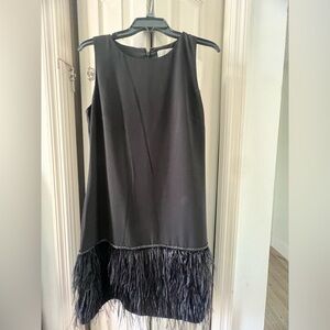 Black dress with Feather hem detail.